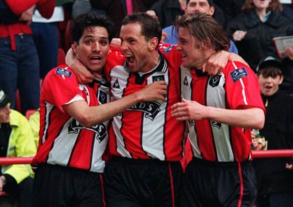 Marcelo celebrates the Blades first goal against Sunderland with David Holdsworth and Wayne Quinn