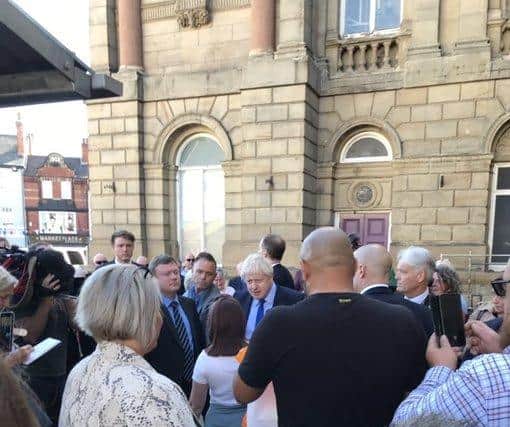 The PM gets a grilling from a resident in Doncaster market