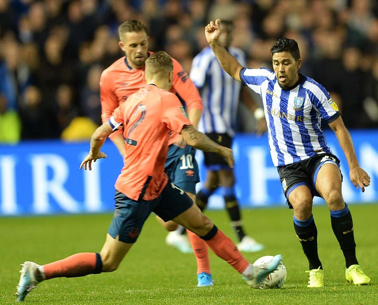 Owls Massimo Luongo tries to find a way through the Everton defence. Pic Steve Ellis