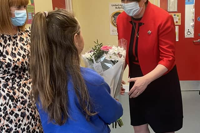 Handout photo taken from the Twitter page of the First Minister of Northern Ireland and Democratic Unionist Party (DUP) leader Arlene Foster during her visit to Maguiresbridge Primary School in Fermanagh. 