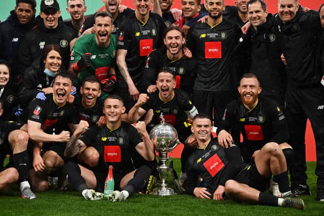 Wembley wonders! Harrogate Town players celebrate their FA Trophy victory.