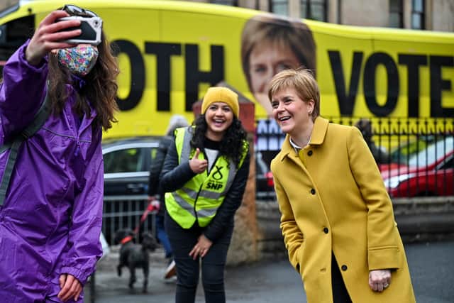 First Minister and leader of the SNP Nicola Sturgeon and candidate Roza Salih arrive to cast votes in the Scottish Parliamentary election at the Annette Street school in Govanhill, Glasgow.