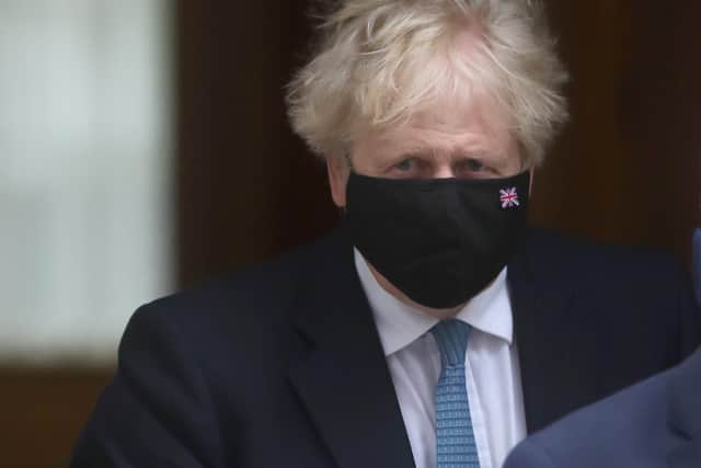 Prime Minister Boris Johnson leaves 10 Downing Street for the Houses of Parliament in London, to make a speech about the Covid-19 pandemic. 