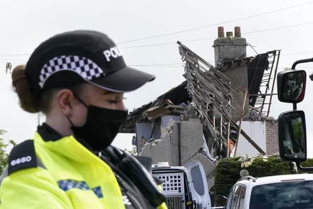Emergency workers at the scene of a suspected gas explosion, in which a young child was killed and two people were seriously injured, on Mallowdale Ave Heysham which caused 2 houses to collapse and badly damaged another.