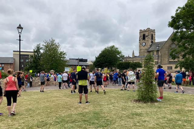 This is the ‘holding area’ outside Sunderland Minster where people are waiting for their colours to the called up to make their way to the starting line