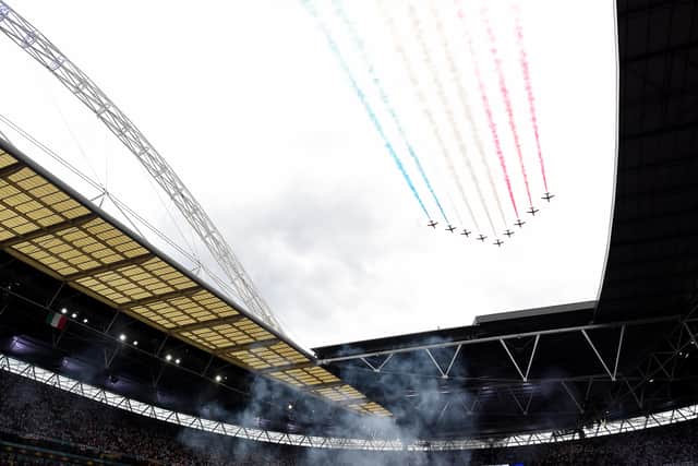 The Red Arrows perform a flyover above Wembley stadium in support of the England team prior to the UEFA Euro 2020 Championship Final