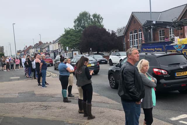 Mourners line Sheffield Road ahead of Gracie’s funeral.