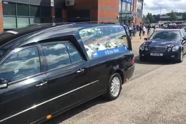 Ernie Moss’ funeral procession has arrived at the Technique Stadium.