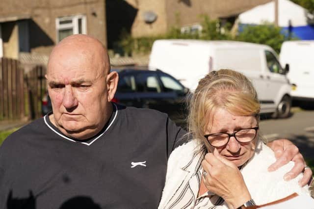 Debbie and Trevor Bennett, the grandparents of two of the victims, speaking to the media at the scene in Chandos Crescent in Killamarsh, near Sheffield, where four people were found dead at a house on Sunday. Derbyshire Police said a man is in police custody and they are not looking for anyone else in connection with the deaths. Photo by: Danny Lawson/PA Wire