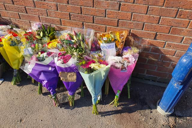Floral tributes have been  left at the scene of a fatal collision near a Sheffield school