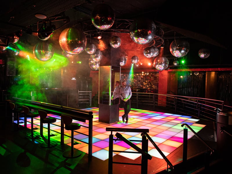 Broad Street has a lot on offer for those who want to shake a leg. PRYZM, Reflex and Popworld come alive on the weekend for the movers and shakers (Photo by OLI SCARFF/AFP via Getty Images)
