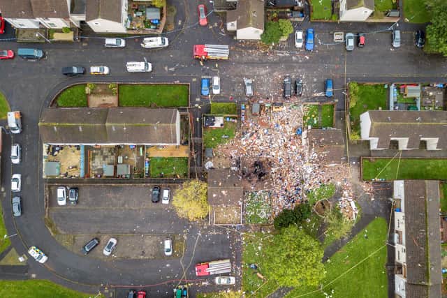 Aerial view of the devastation cause by an explosion on Kincaidston Drive, Ayr, on Monday. Two adults and two children have been taken to hospital and olice say four homes were caught up in the blast.