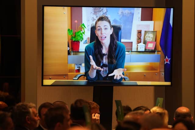 A video message from New Zealand Prime Minister Jacinda Ardern is played to the audience during the CBI COP26 international Business Dinner during the COP26 summit in Glasgow