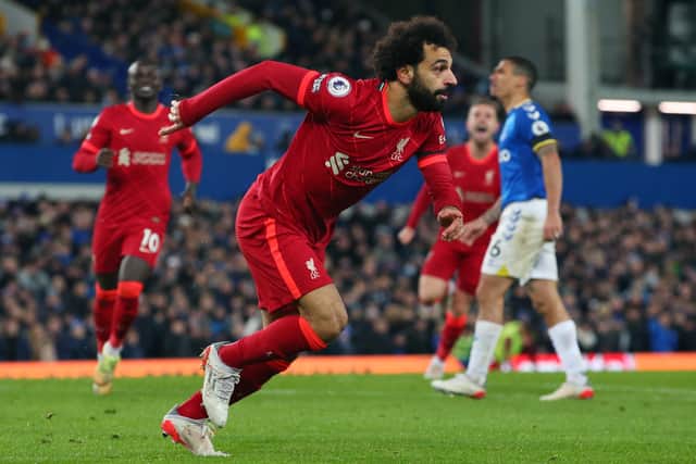 Mohamed Salah of Liverpool celebrates after scoring their side's third goal during the Premier League match between Everton and Liverpool at Goodison Park on December 01, 2021 in Liverpool, England. (Photo by Alex Livesey/Getty Images)