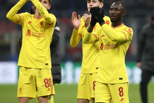 Naby Keita, right, celebrates Liverpool’s victory over AC Milan. Picture: Marco Luzzani/Getty Images