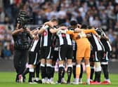 Newcastle United’s players form a group huddle ahead of the Premier League match with Tottenham Hotspur. 