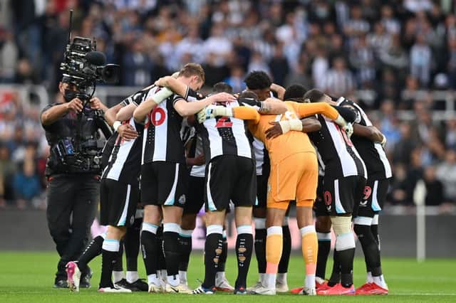 Newcastle United’s players form a group huddle ahead of the Premier League match with Tottenham Hotspur. 