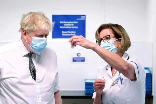 Prime Minister Boris Johnson during a visit to a vaccination centre in Northamptonshire on 6 January (image: PA)