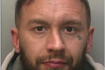 Jack Mayle, 30,  who was previously of Caterham, Surrey is wanted by Surrey Police. 
He was charged with supply of  MDMA, methylphenidate and diazepam. He allegedly ran a drug line in South London and Surrey called the Flavour Quest. Mayle is around 5ft 11 in tall and muscular, he has several distinctive tattoos including one of a  diamond  under his left eye. He is from Croydon and has and ‘Croydon’ inked on the outside of his left forearm.
Mayle may have tried to alter his appearance. 
 He is known to carry weapons; is a regular gym goer and vegan. He has links to Spain.