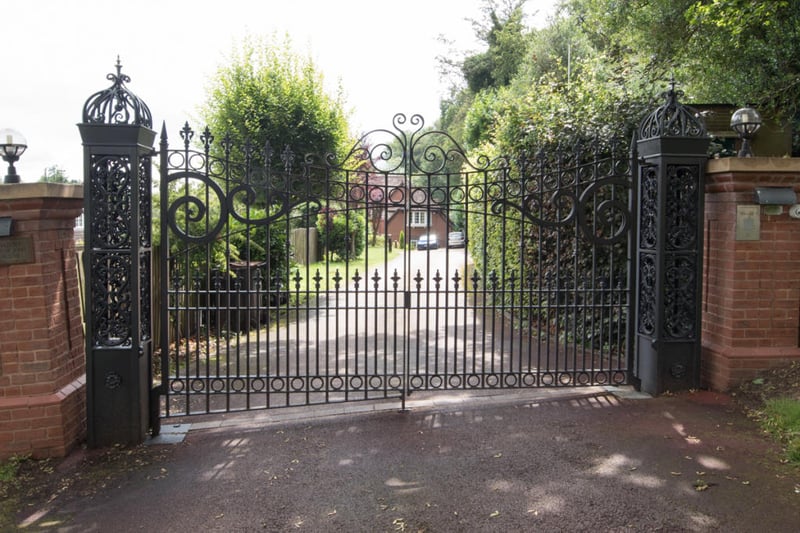 The electronically controlled gate leading on to the large driveway to where the home is located.
