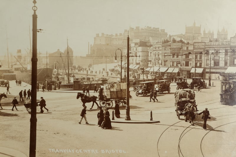 Tramway Centre shown to be busy with horse-drawn carts and cars. A ship can be seen docked in the background. The road seen leading toward St Augustine’s Parade has now gone and the site is now known as the Fountains. 