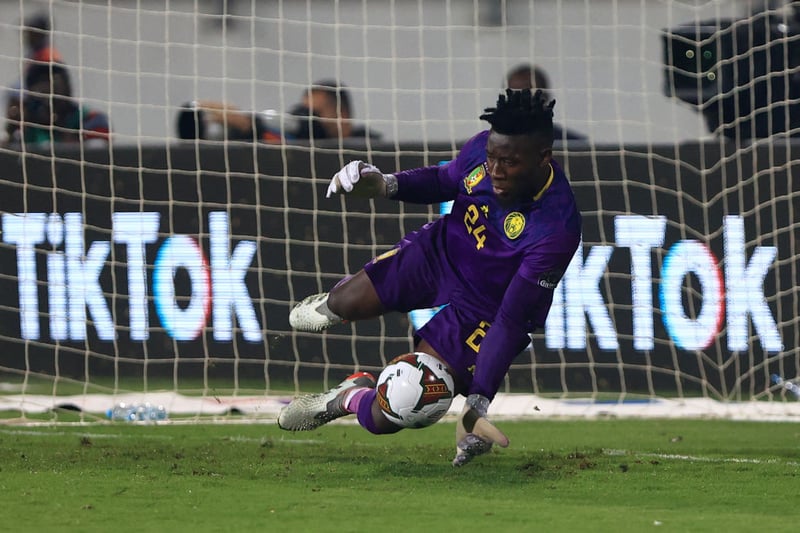 Linked with Arsenal more than once in real life, the Cameroonian stopper eventually signs in 2024 to great success.  (Photo by DANIEL BELOUMOU OLOMO/AFP via Getty Images)