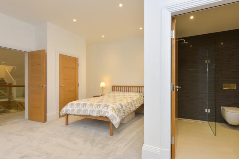 One of the bedrooms with an en suite and view of the landing 