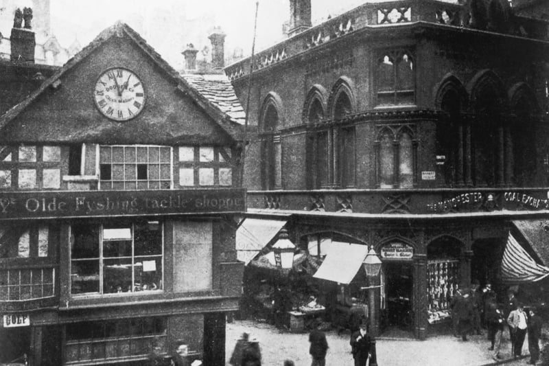Ye Olde Fyshing Tackle Shoppe and the Coal Exchange in Manchester Market Place, circa 1900.