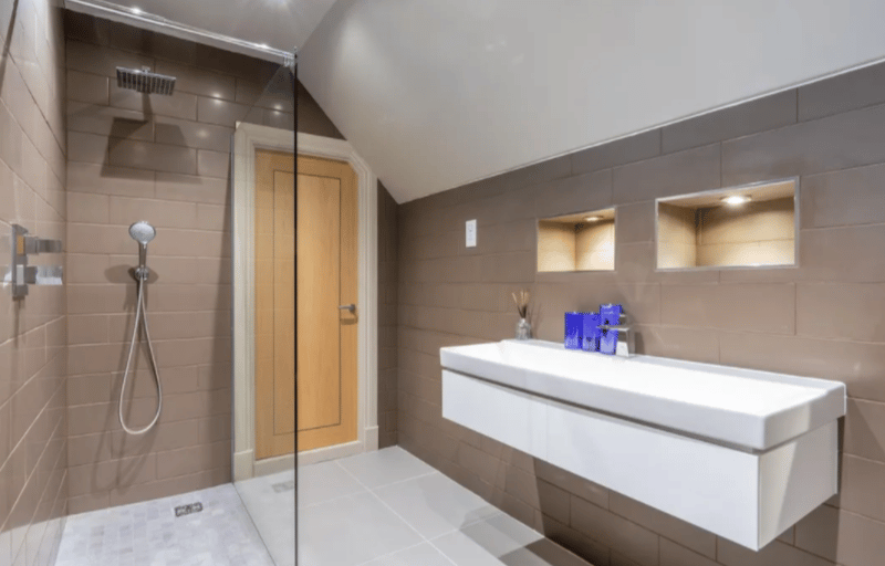 Bathroom with spacious shower and sinks. 