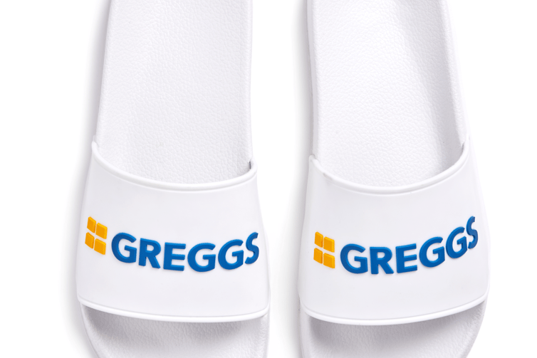 “Slide in to your local Greggs branch in style with the this hot take on the classic sandal design in a fresh white, yellow and blue. ”