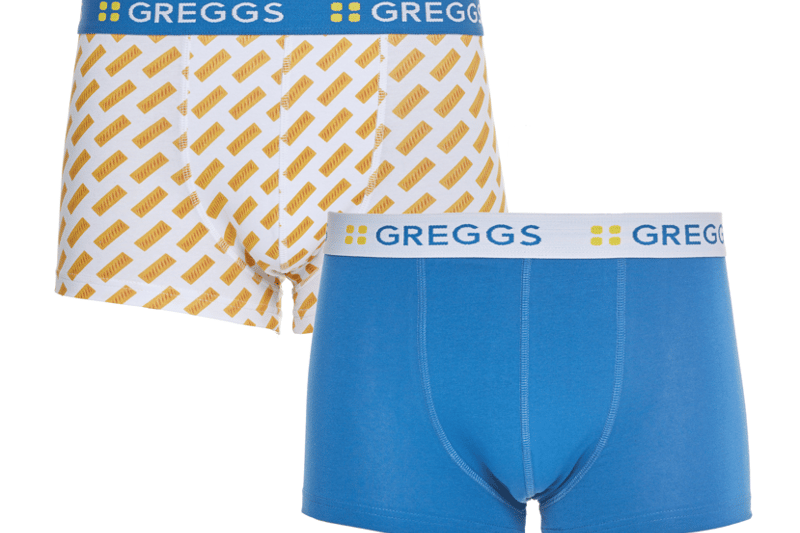 “Greggs two-piece underpants set combines a repeat sausage roll design with a set of vibrant blue briefs, a perfect novelty present for pastry fans.”