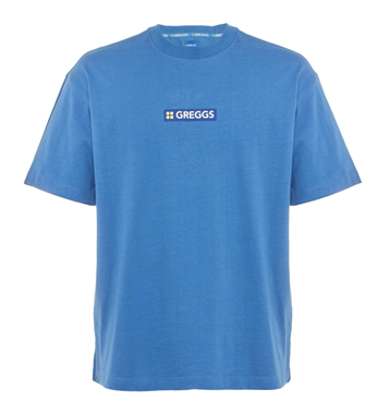 “Combining one layer of cotton with 96 layers of tasty, this blue crewneck T-shirt keeps it simply scrumptious, featuring a small Greggs logo on the front and stretched vertical logo design on the back.”