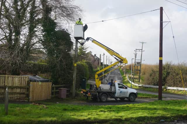 Engineers  work to restore power after a branch brought down a power line and temporarily obstracted the main road between Lurgan and Banbridge 