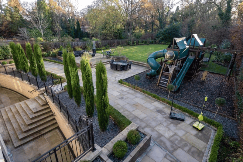 The house benefits from generous landscaped gardens