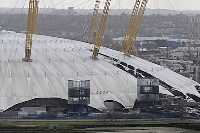 Handout photo taken with permission from the Twitter feed of @MalaSharma18 showing the Millenium Dome in Greenwich, south London, with roof panels missing (bottom right) after they were blown off in Storm Eunice.
