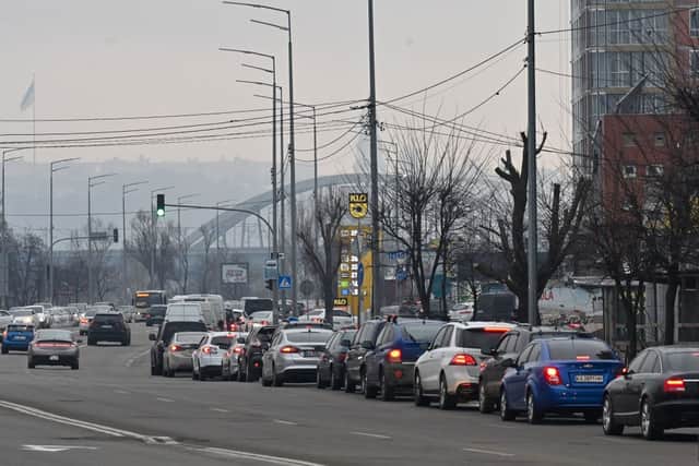 People queue to a petrol station in Kyiv (Photo by GENYA SAVILOV / AFP) (Photo by GENYA SAVILOV/AFP via Getty Images)