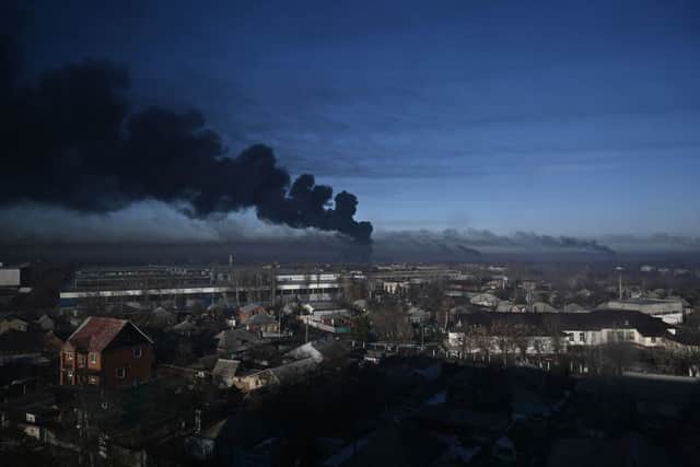 Black smoke rises from a military airport in Chuguyev near Kharkiv (Photo by Aris Messinis / AFP) (Photo by ARIS MESSINIS/AFP via Getty Images)