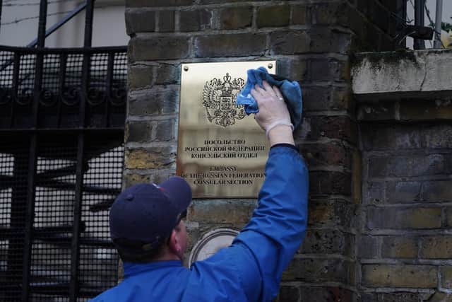 The plaque outside the Russian Embassy in west London is cleaned, following the Russian invasion of Ukraine