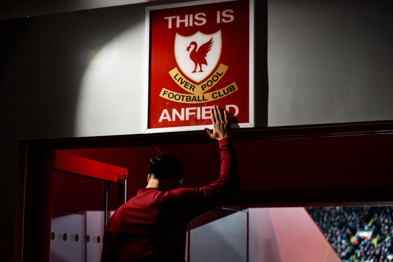 Virgil van Dijk touches the famous ‘This Is Anfield’ sign before heading out onto the pitch. Liverpool would go on to run riot against a lacklustre Leeds side. (Photo by Andrew Powell/Liverpool FC via Getty Images)