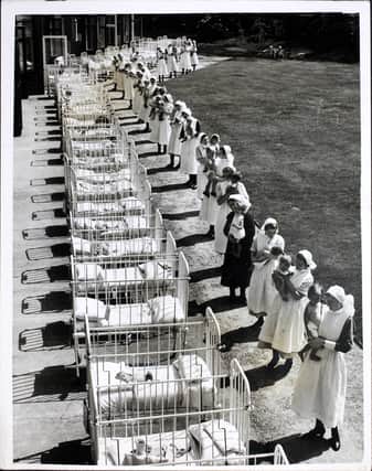Nurses bring the babies out in their cots for a spot of sun at the Duchess of York’s Hospital for Babies at Burnage, Manchester, where some of the infants spend the whole day in the open, June 1939. 