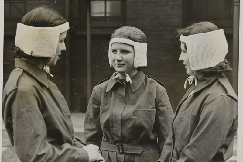 Siren Suits And Head Pads For Nurses In Air Raids, Nurses of the St. Mary ‘s Hospital for Women and Children, Manchster, are provided with siren suits for air raid duties.