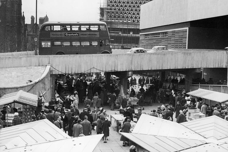 The flyover opens at the Bull Ring Market in 1963. The Bull Ring Centre is under construction to the right