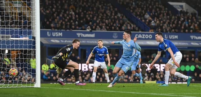 LIVERPOOL, ENGLAND - FEBRUARY 26: Phil Foden of Manchester City scores their team’s first goal past Jordan Pickford of Everton during the Premier League match between Everton and Manchester City at Goodison Park on February 26, 2022 in Liverpool, England. (Photo by Michael Regan/Getty Images)