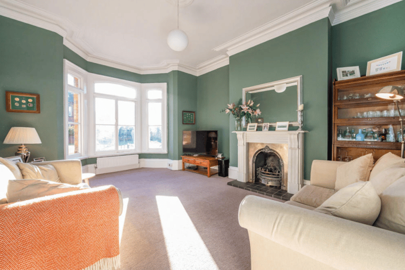 The property’s reception rooms boast lovely period features like this bay window