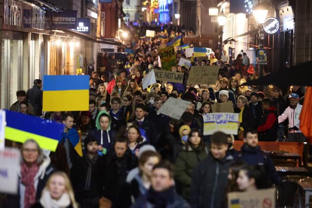 People gather at Bristol’s College Green to march through the streets as part of the Bristol Solidarity With Ukraine demonstration.