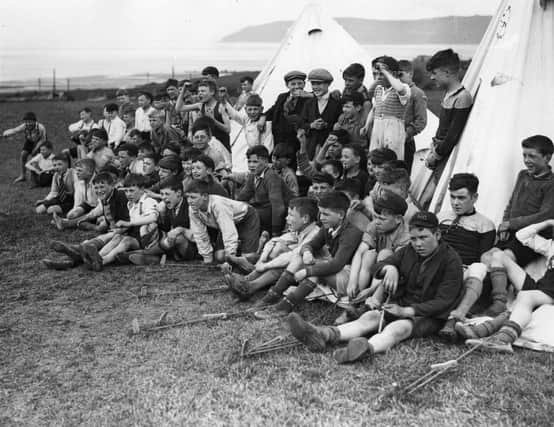 Boys of the Hugh Oldham Lads’ Club  of Manchester watching sports at their camp at Penmaen-bach, 25th May 1932.
