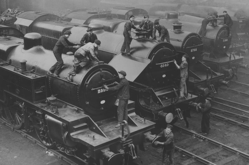 Railway engines at the Longsight loco sheds, Manchester being cleaned in preparation for the Whitsun holiday rush, 1936