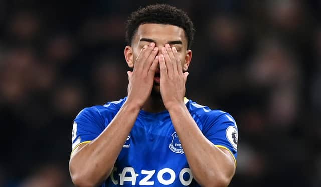 Mason Holgate of Everton looks dejected after Harry Kane of Tottenham Hotspur scores their sides third goal during the Premier League match between Tottenham Hotspur and Everton at Tottenham Hotspur Stadium on March 07, 2022 in London, England. (Photo by Shaun Botterill/Getty Images