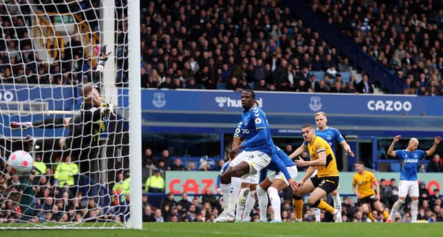 Conor Coady of Wolverhampton Wanderers scores their side's first goal during the Premier League match between Everton and Wolverhampton Wanderers at Goodison Park on March 13, 2022 in Liverpool, England. (Photo by Naomi Baker/Getty Images)