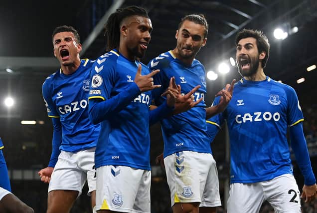 LIVERPOOL, ENGLAND - MARCH 17: Alex Iwobi of Everton celebrates with team mates after scoring their sides first goal during the Premier League match between Everton and Newcastle United at Goodison Park on March 17, 2022 in Liverpool, England. (Photo by Stu Forster/Getty Images)